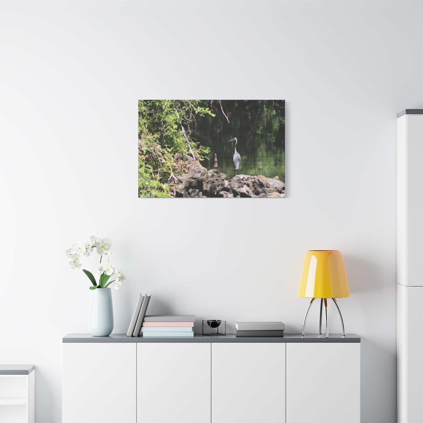Anhinga bird canvas art featuring a serene lakeside view with lush greenery