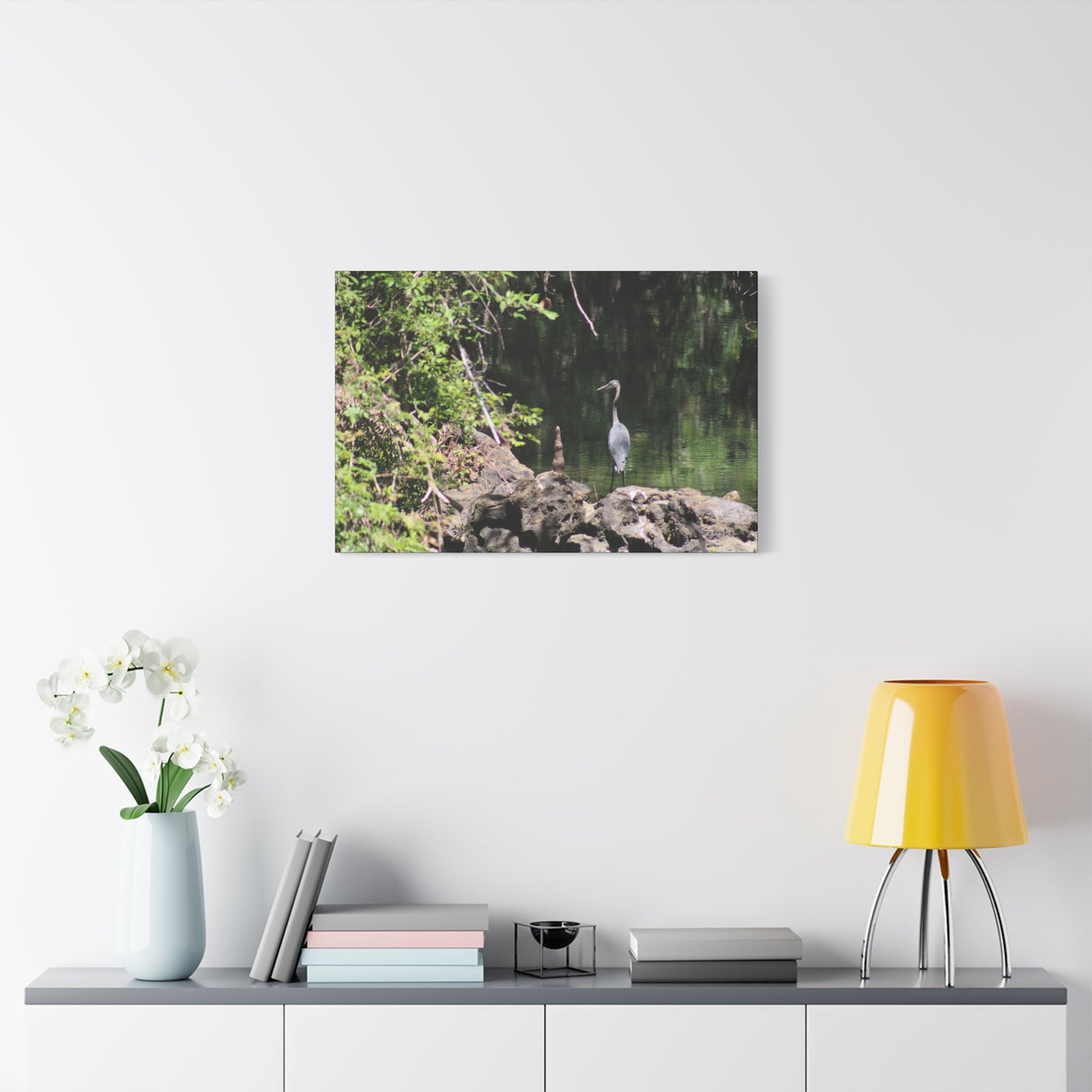Anhinga bird canvas art featuring a serene scene with a bird by the water amidst lush greenery