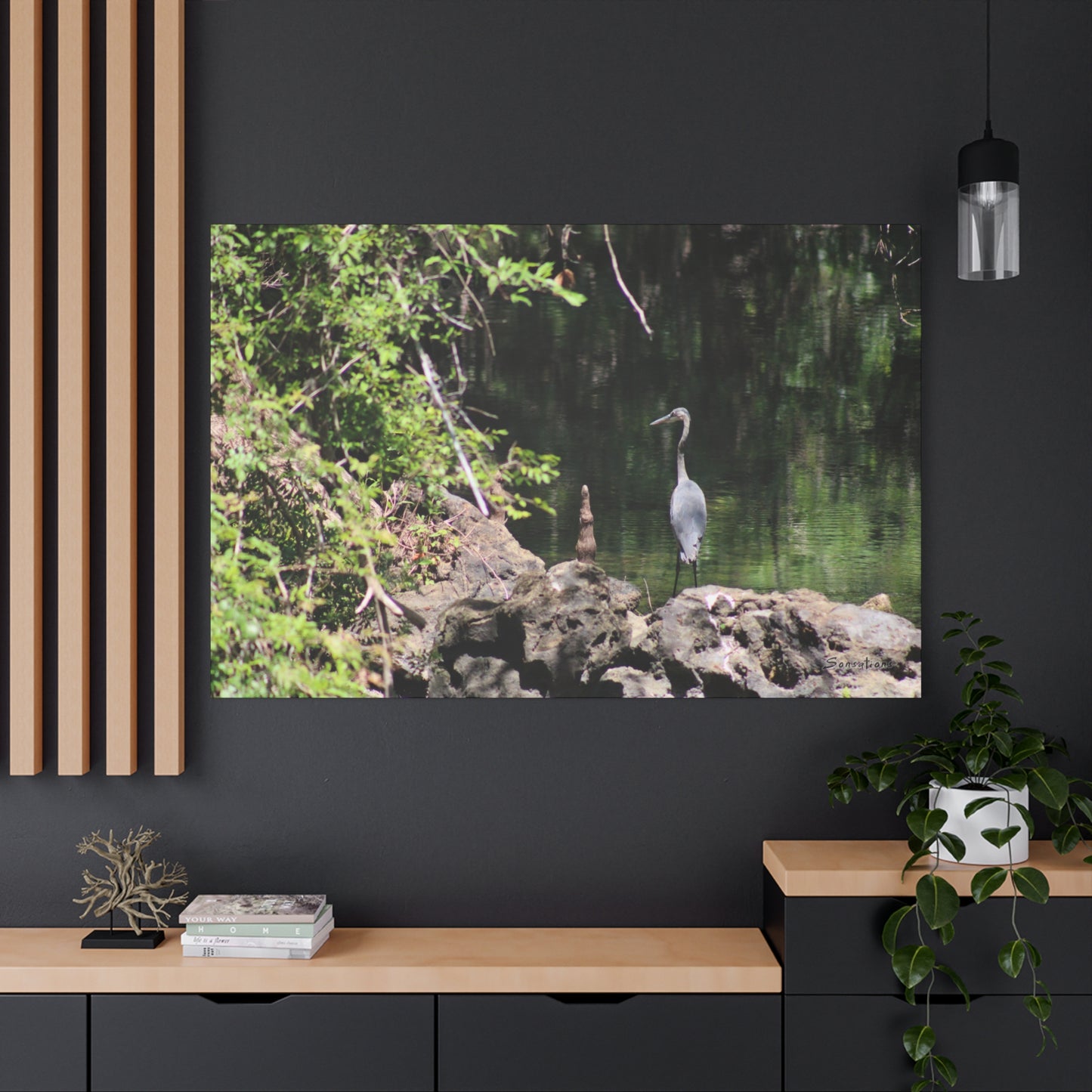 Anhinga bird canvas art depicting a bird by a calm lake surrounded by lush greenery