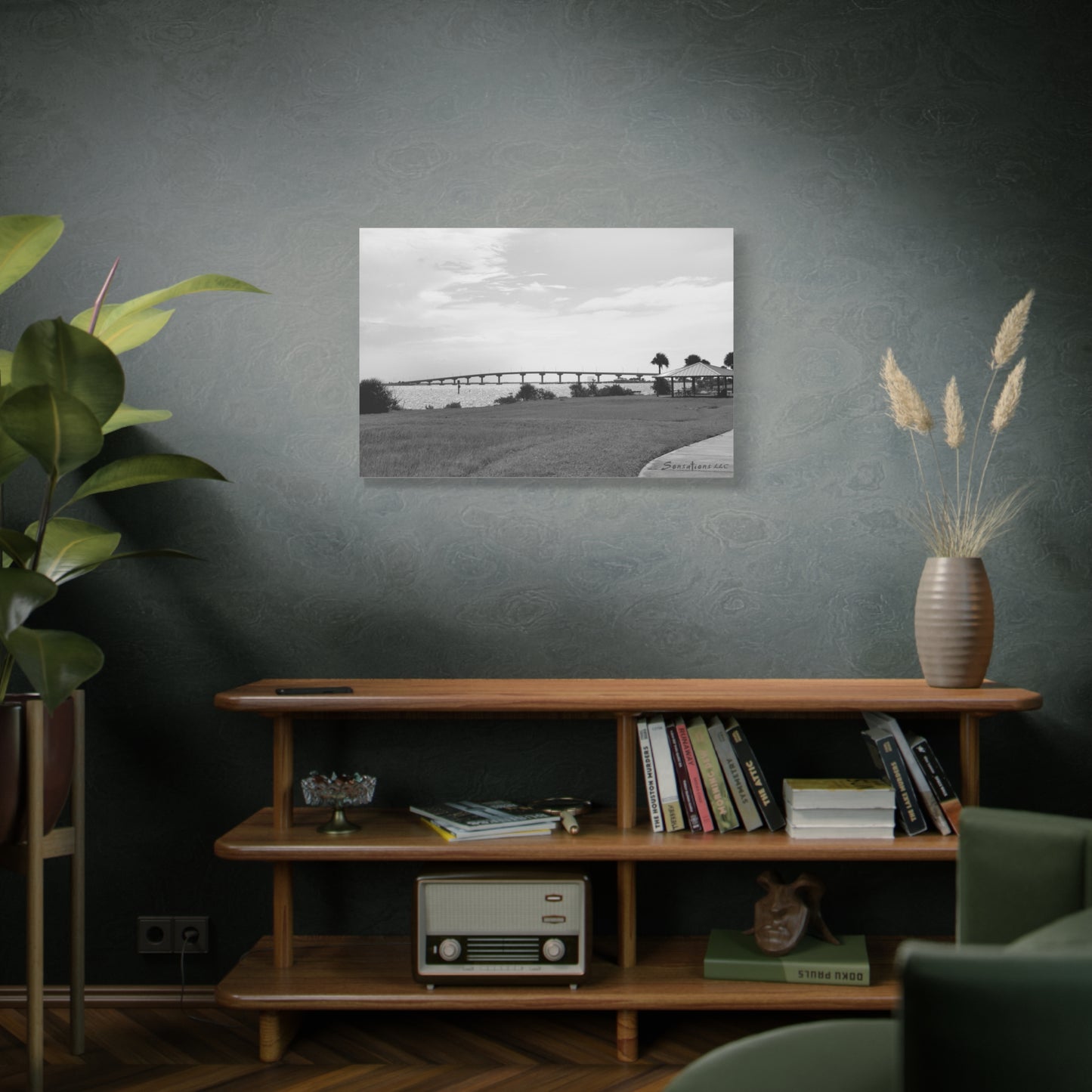 Black and white modern bridge canvas art displayed on a green wall in a stylish interior