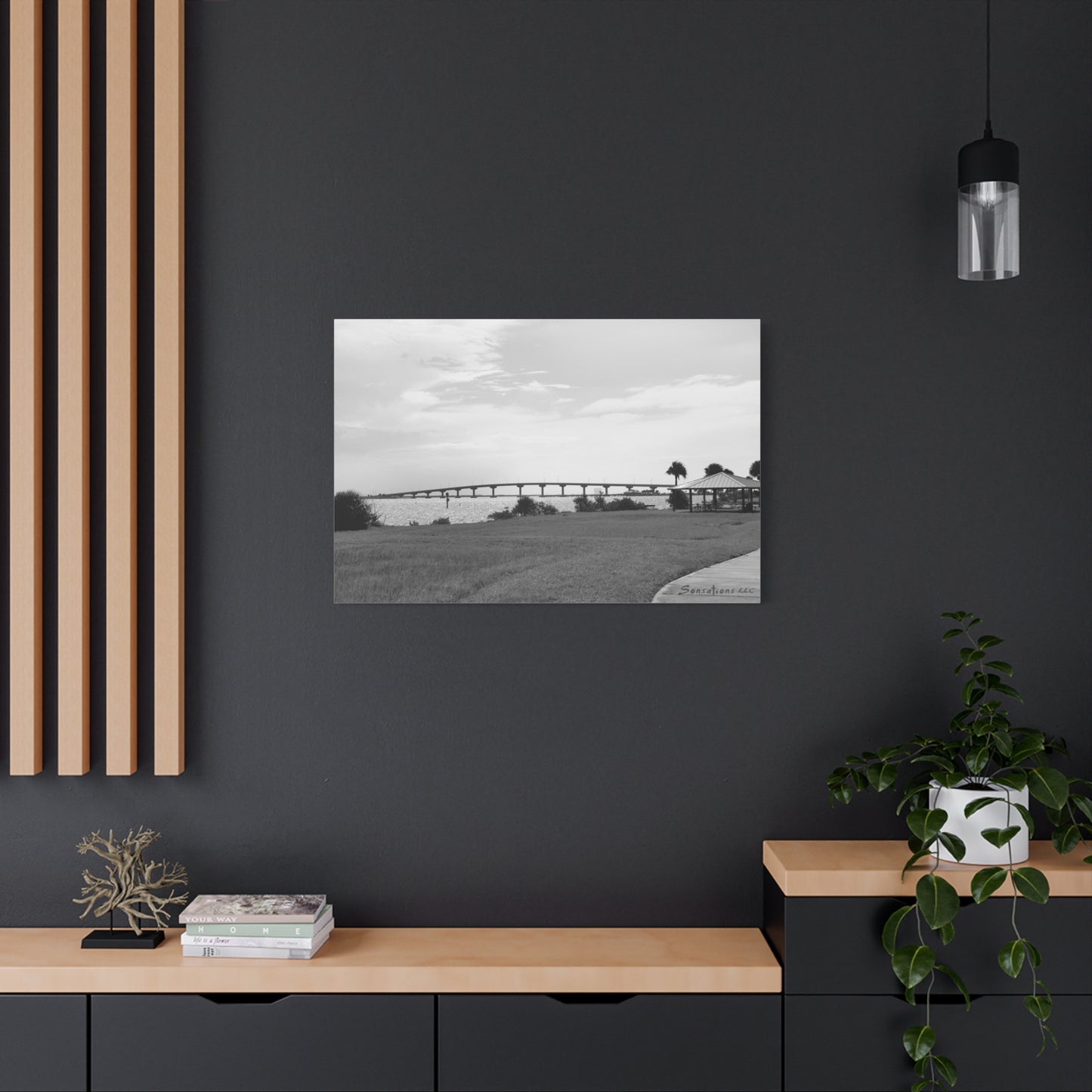 Black and white modern bridge canvas art displayed on a stylish living room wall