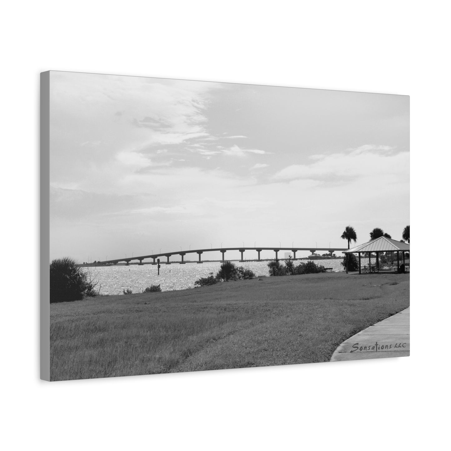Stunning black and white modern bridge canvas art depicting a scenic waterfront view