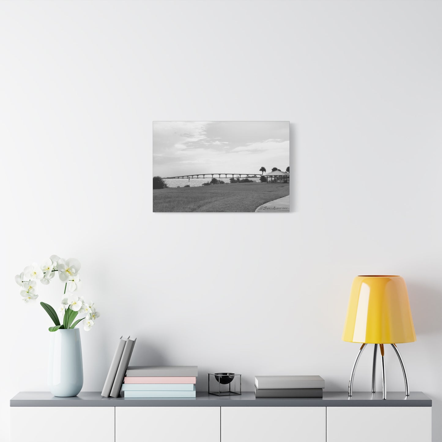 Modern bridge canvas art featuring a scenic black and white view of a bridge over water