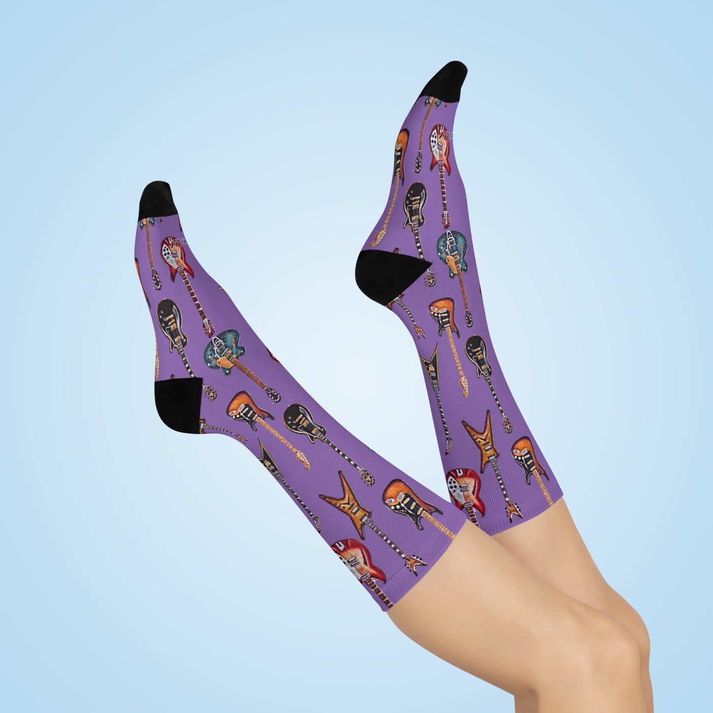 Guitar themed socks featuring vibrant designs of various guitars on a purple background