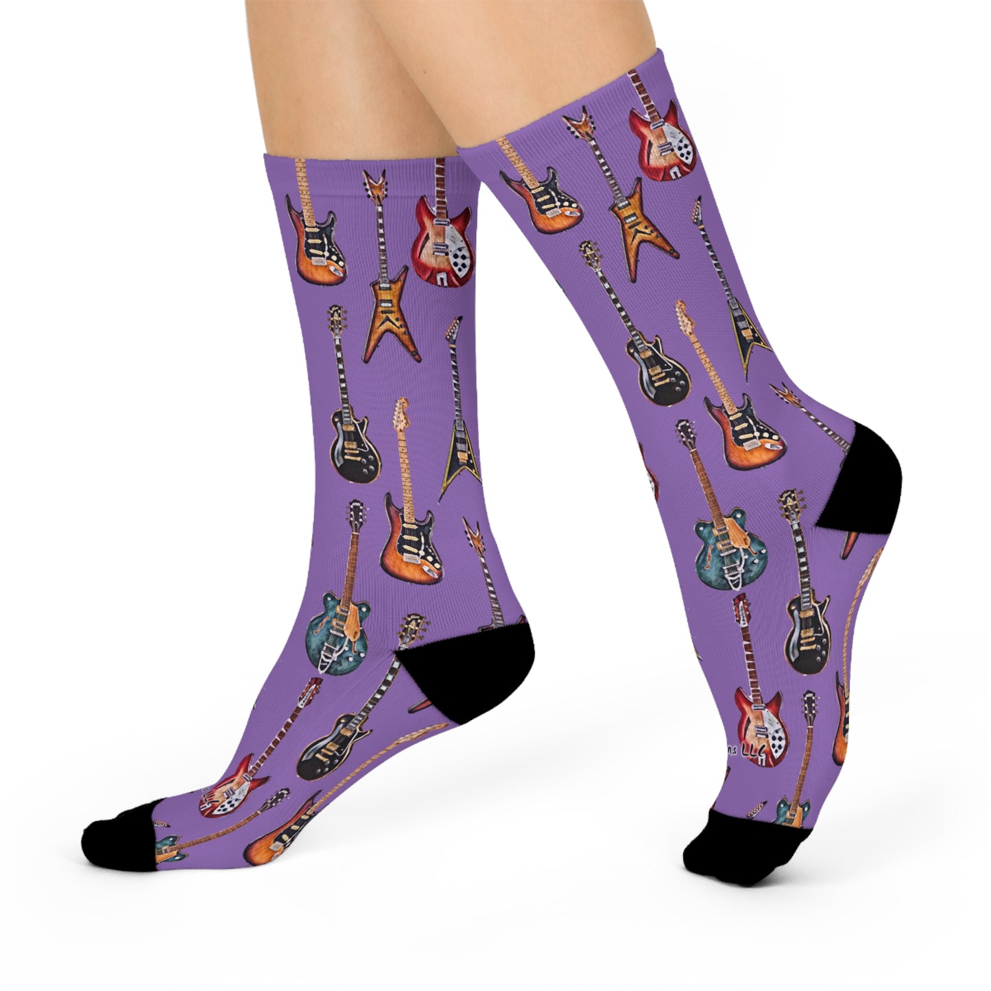Colorful guitar themed socks featuring various guitar designs on a purple background