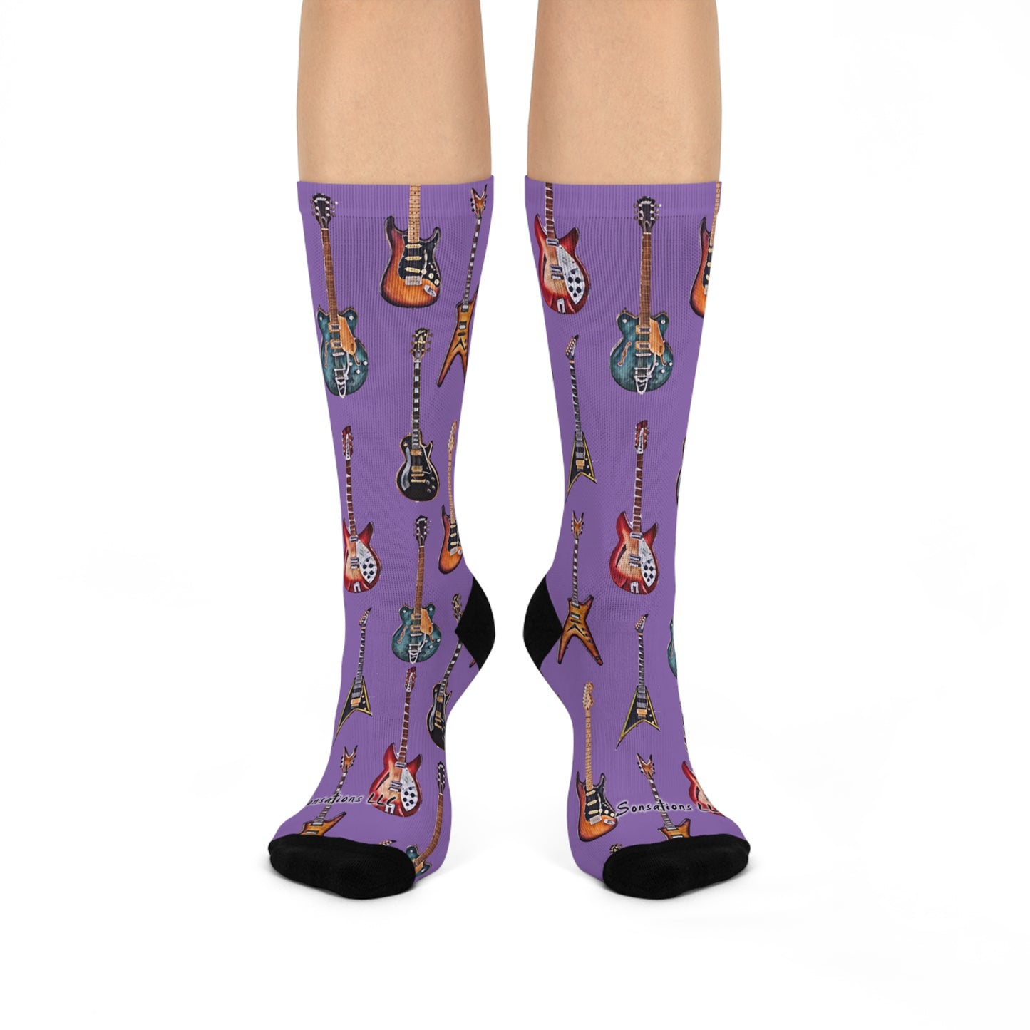 Guitar themed socks featuring colorful guitar prints on a stylish purple background