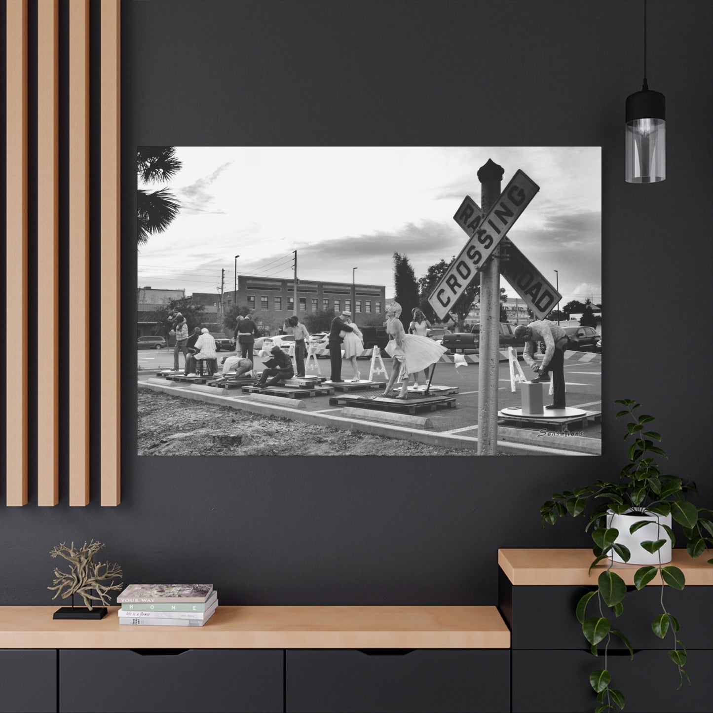 Marilyn Monroe canvas art displayed on a black wall above modern furniture for stylish home decor