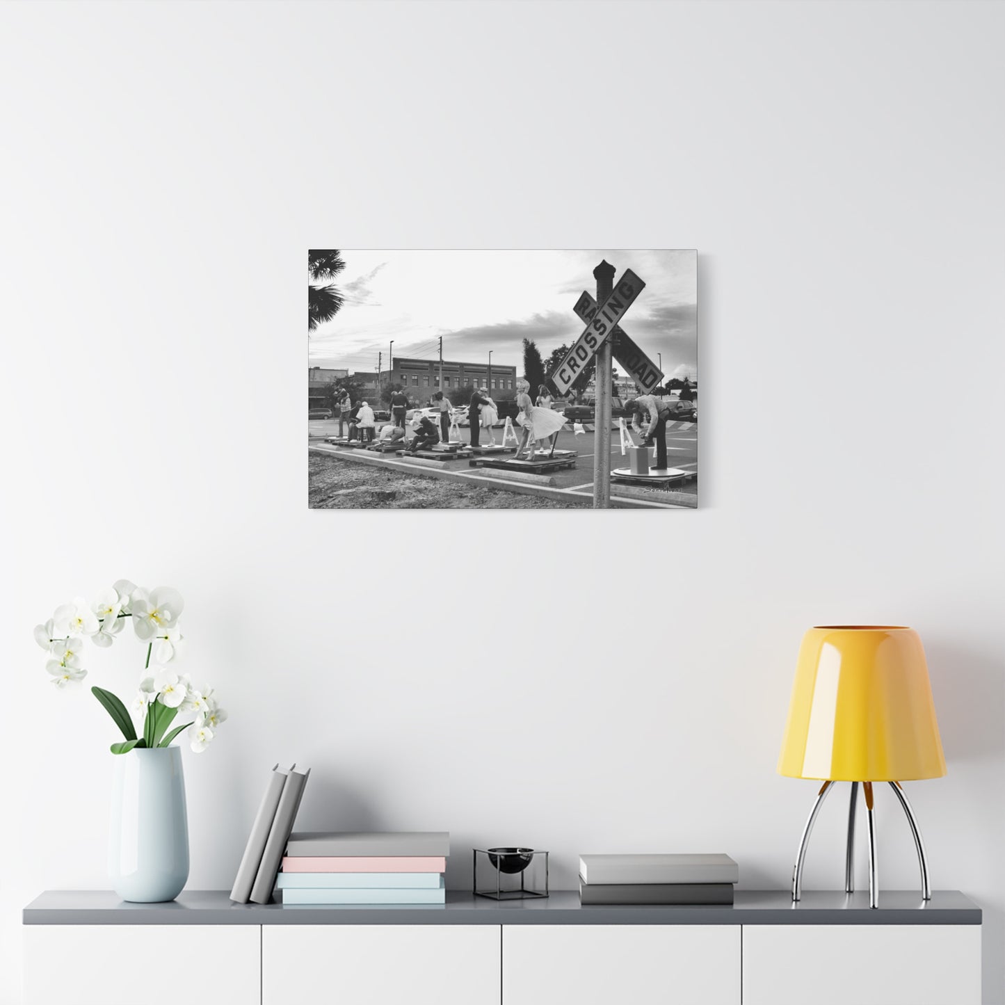Marilyn Monroe canvas art featuring a black and white cemetery scene with flowers and a crossing sign