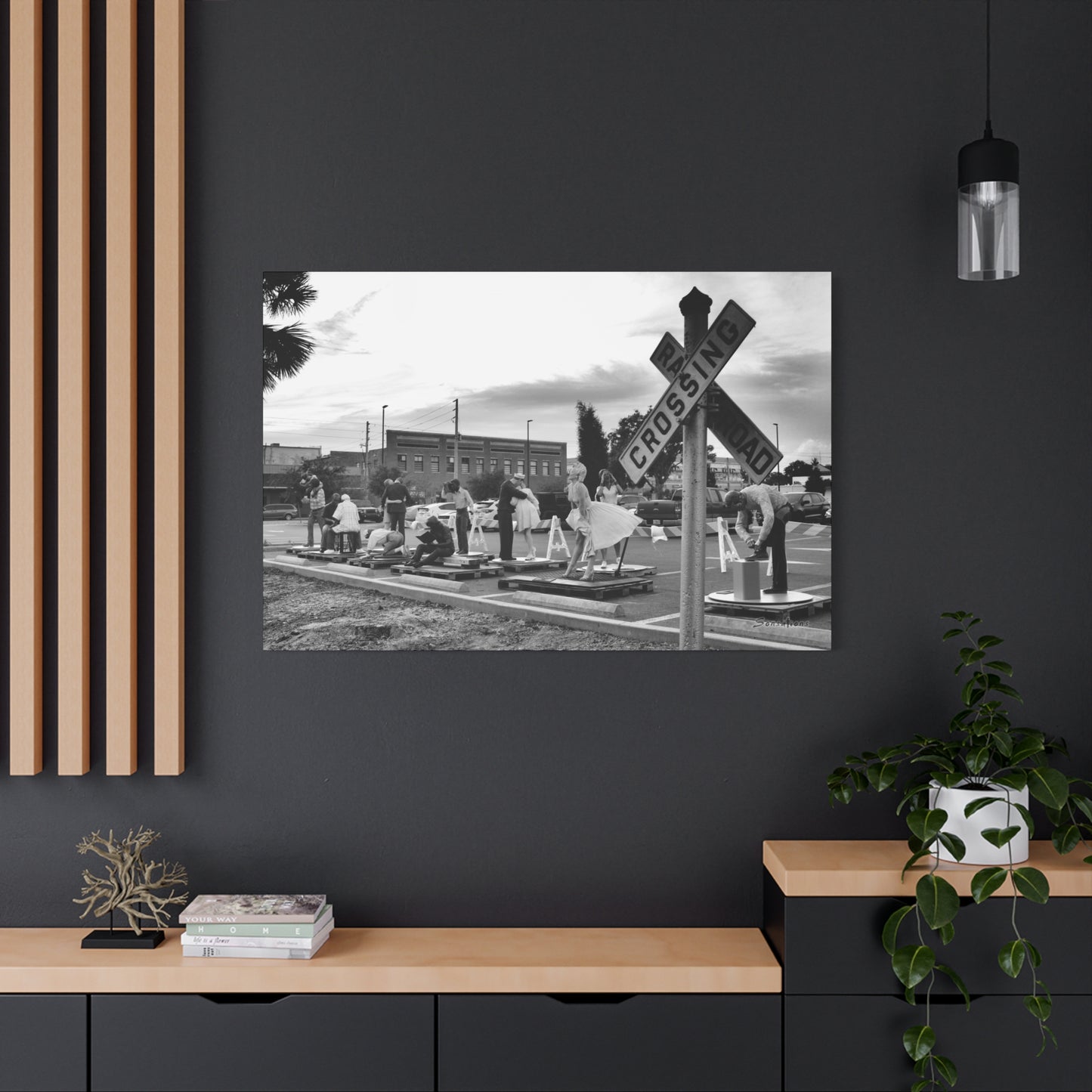 Stylish black and white Marilyn Monroe canvas art displayed above a modern wooden console table
