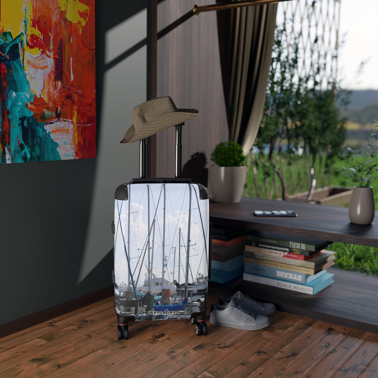 Nautical design suitcase travel luggage featuring boat and ocean imagery for stylish travel enthusiasts