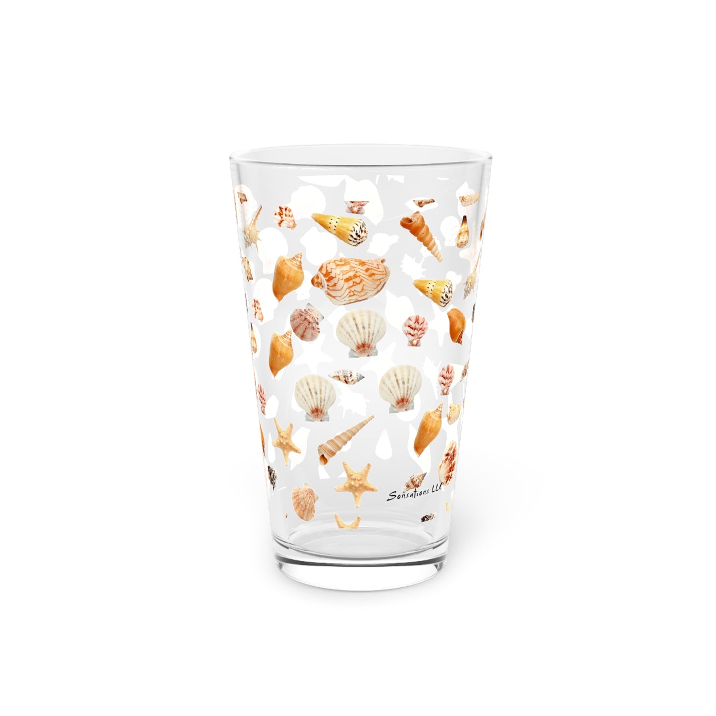 Clear pint glass with a seashell design pint glass featuring colorful seashells and starfish patterns