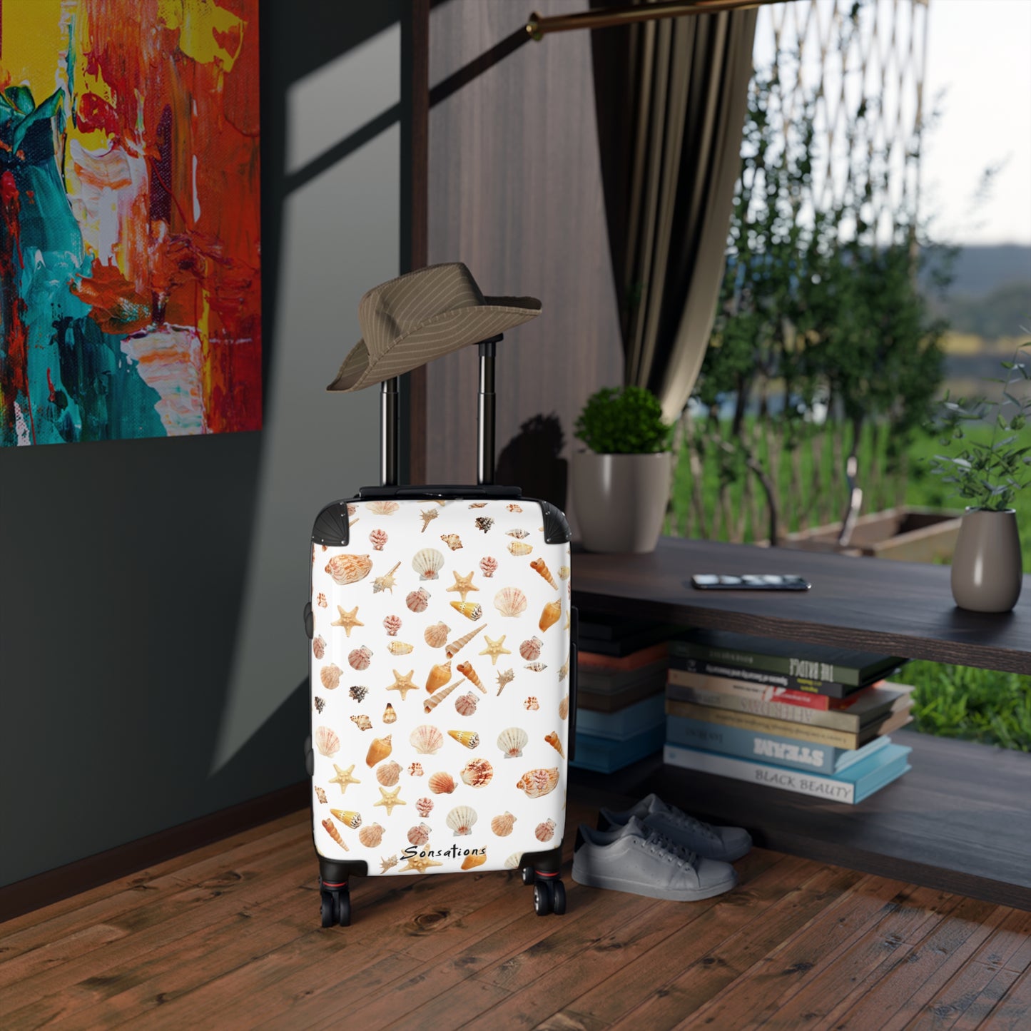 Seashell pattern suitcase designed for travelers with vibrant marine-inspired prints