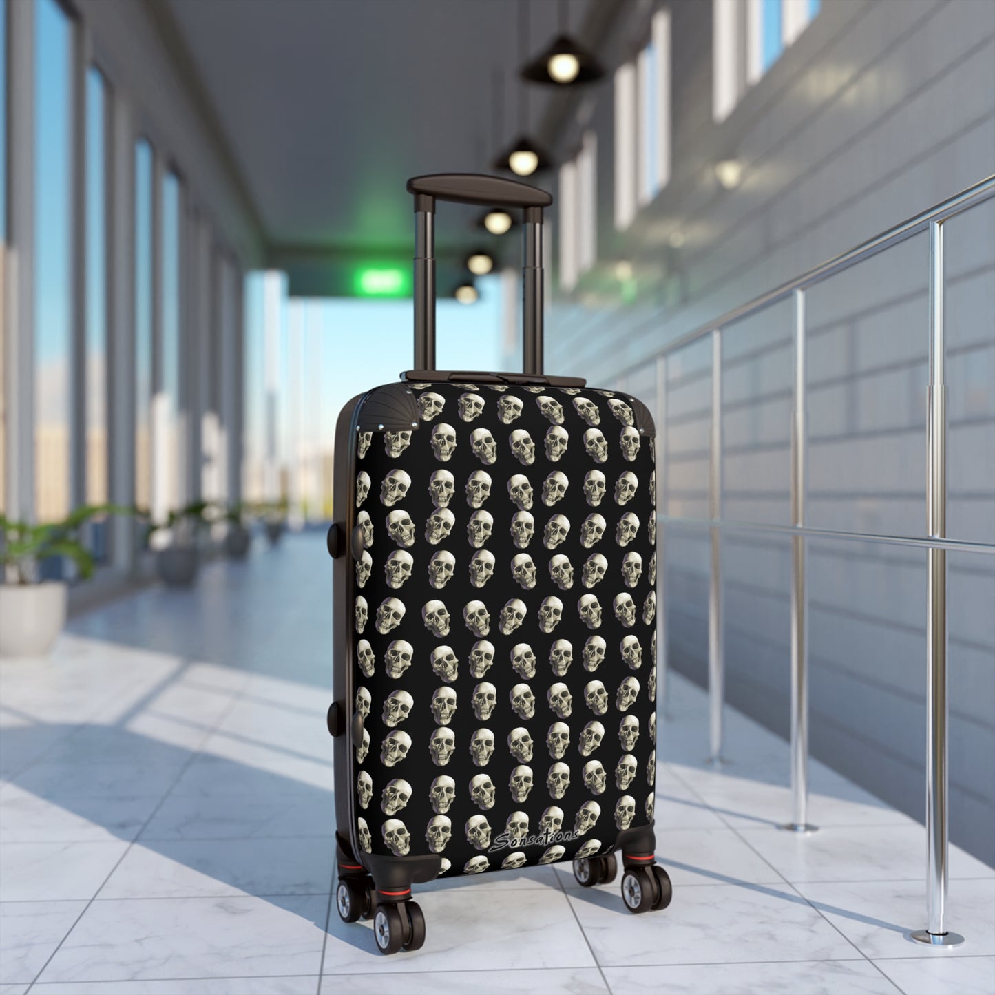 Bold skull print suitcase with durable wheels, perfect for stylish travel and effortless mobility