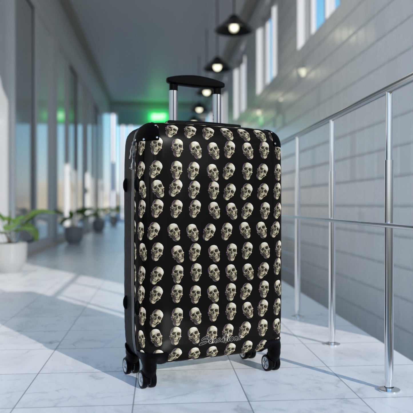 Skull print suitcase featuring stylish skull designs on a black background for unique travel appeal