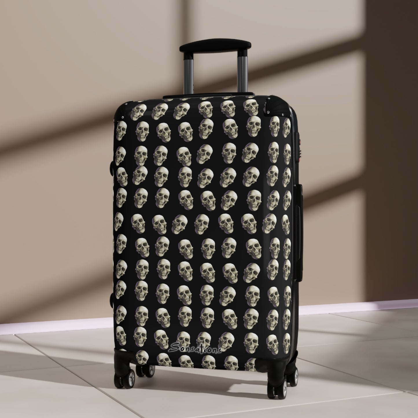 Skull print suitcase featuring a striking design of multiple skulls on a black background for stylish travel