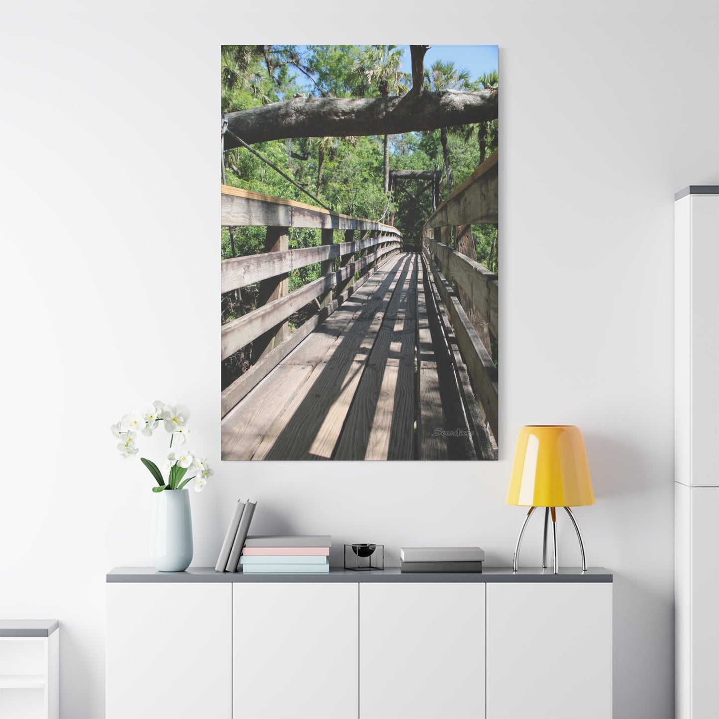 Tranquil bridge nature wall art featuring a wooden path through a serene natural setting