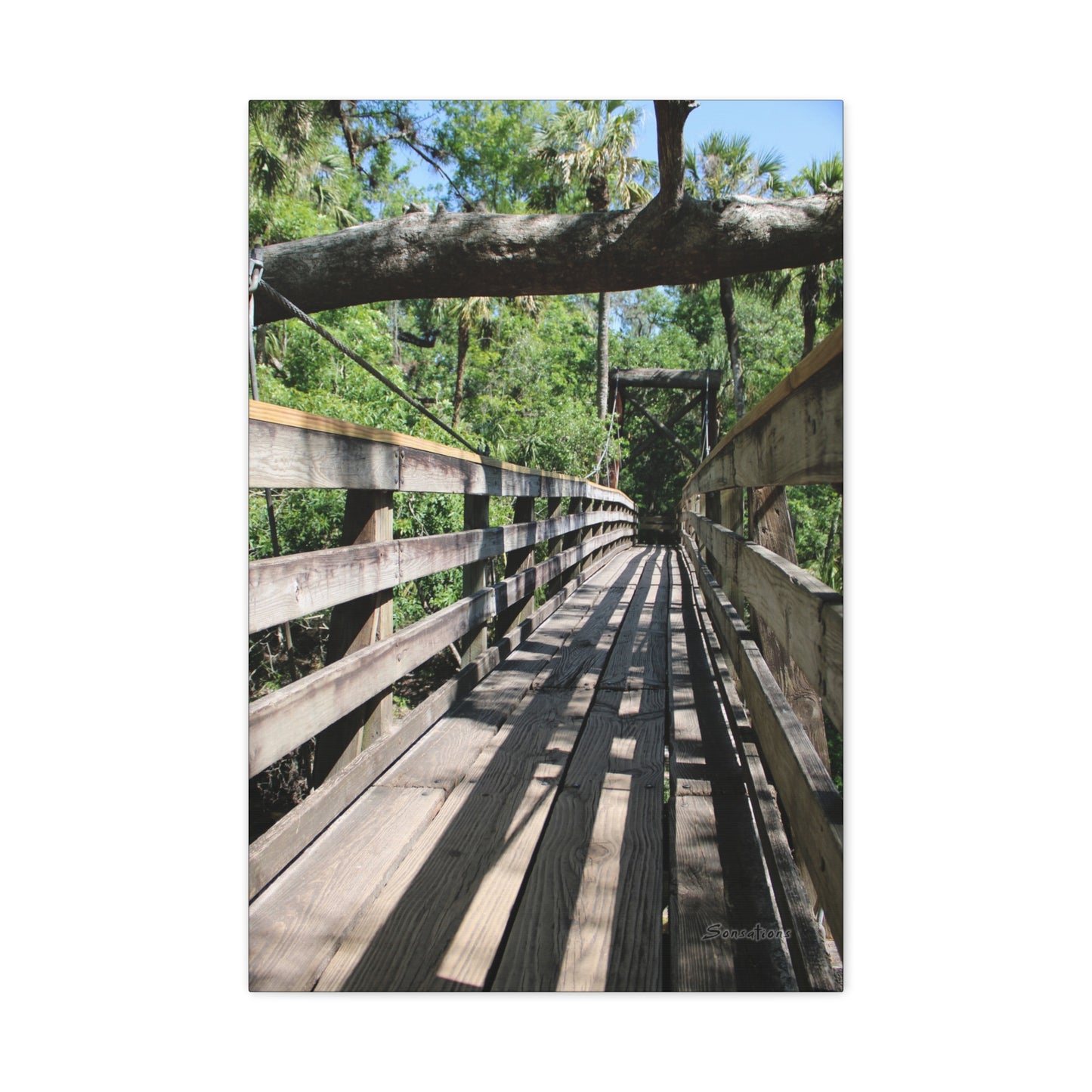 Tranquil bridge nature wall art depicting a serene wooden bridge surrounded by lush greenery