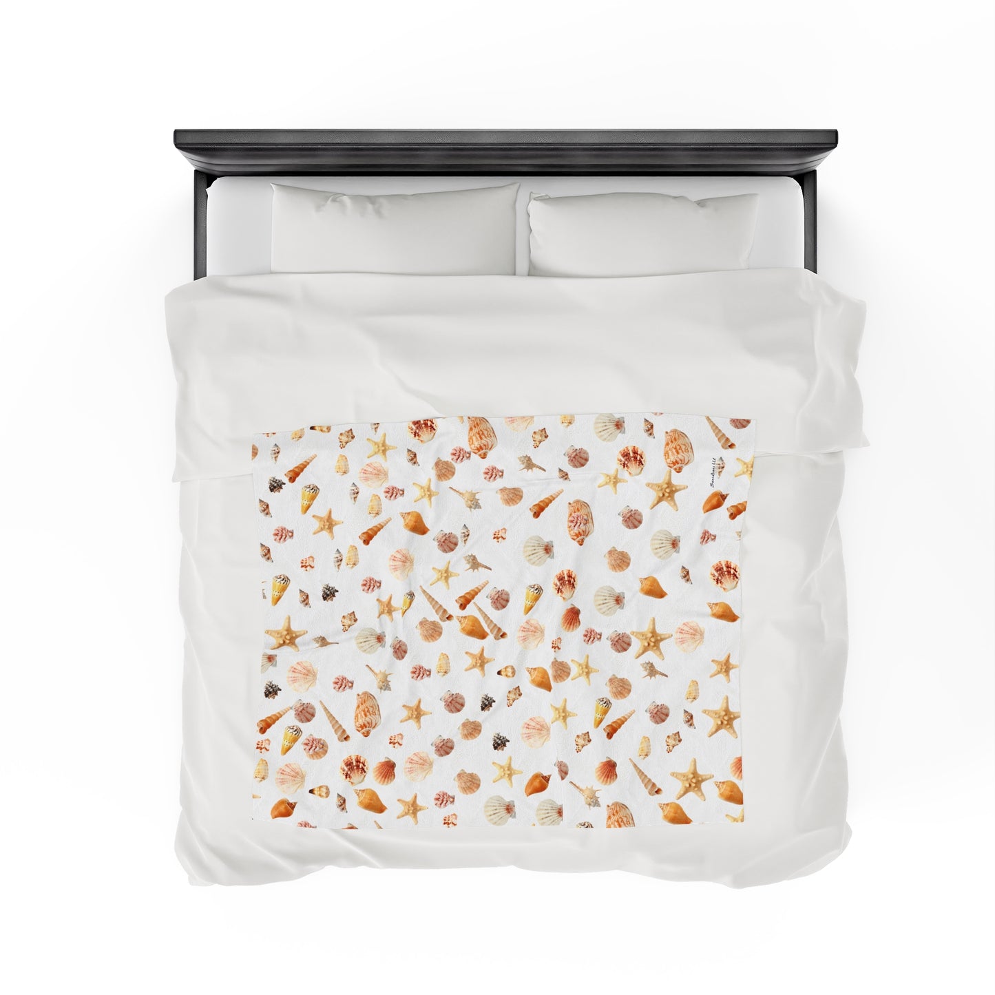 Sea shell velveteen blanket featuring colorful seashells and starfish patterns on a white background