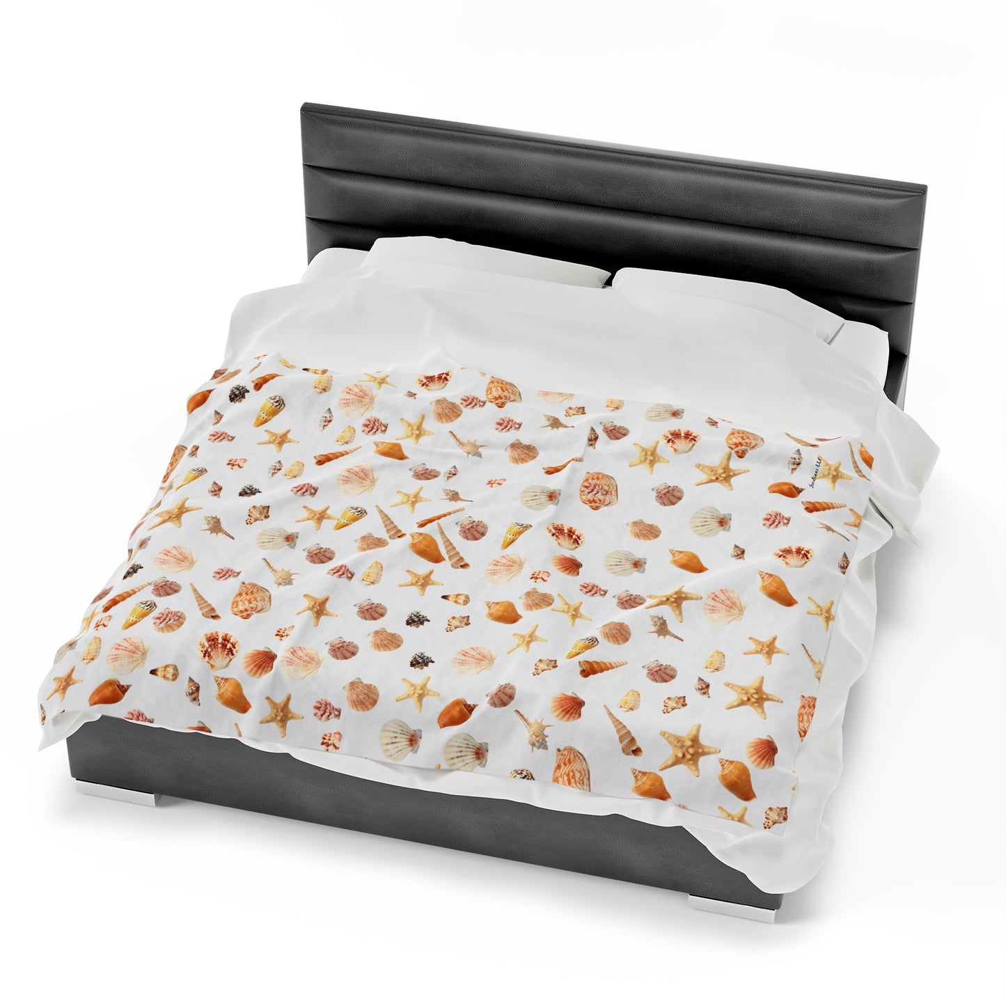 Sea shell velveteen blanket featuring a colorful assortment of seashells and starfish for beach lovers