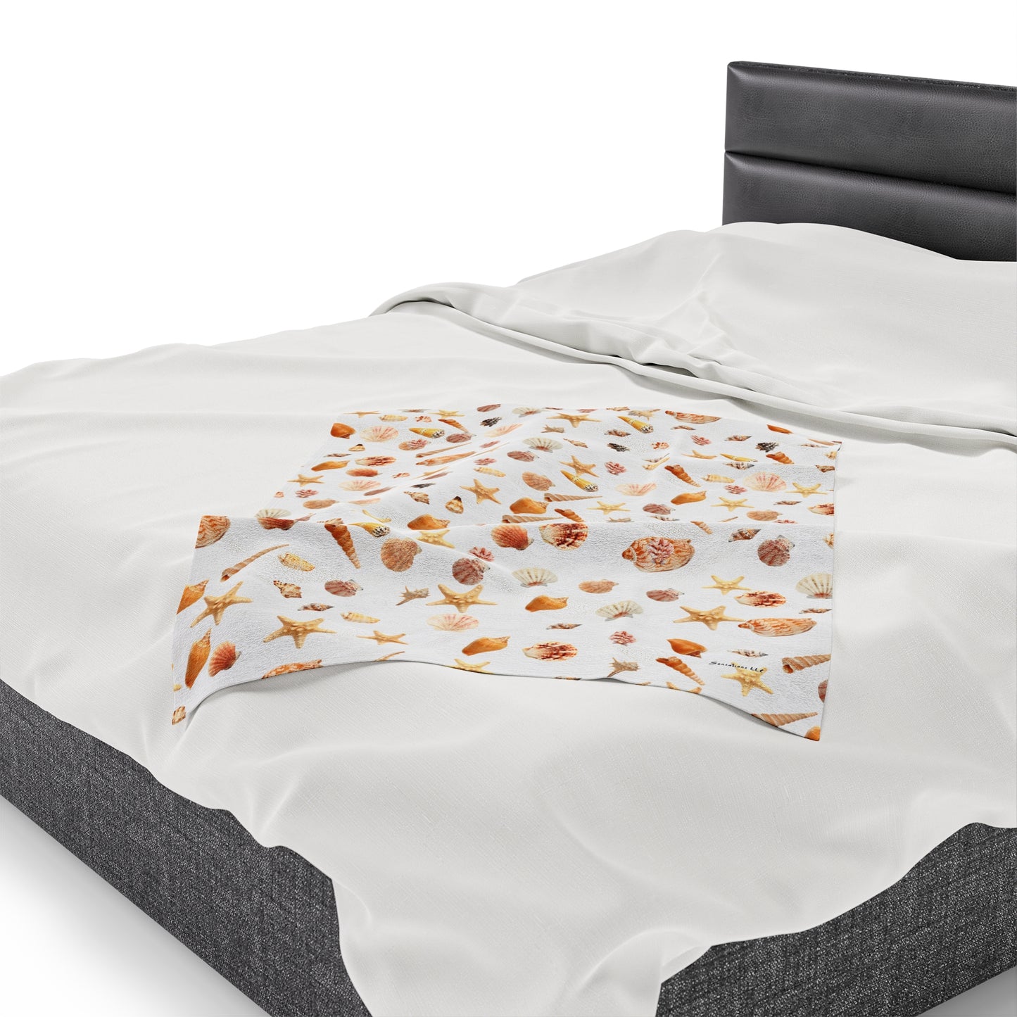 Sea shell velveteen blanket featuring a vibrant all over print on a soft fabric for cozy warmth