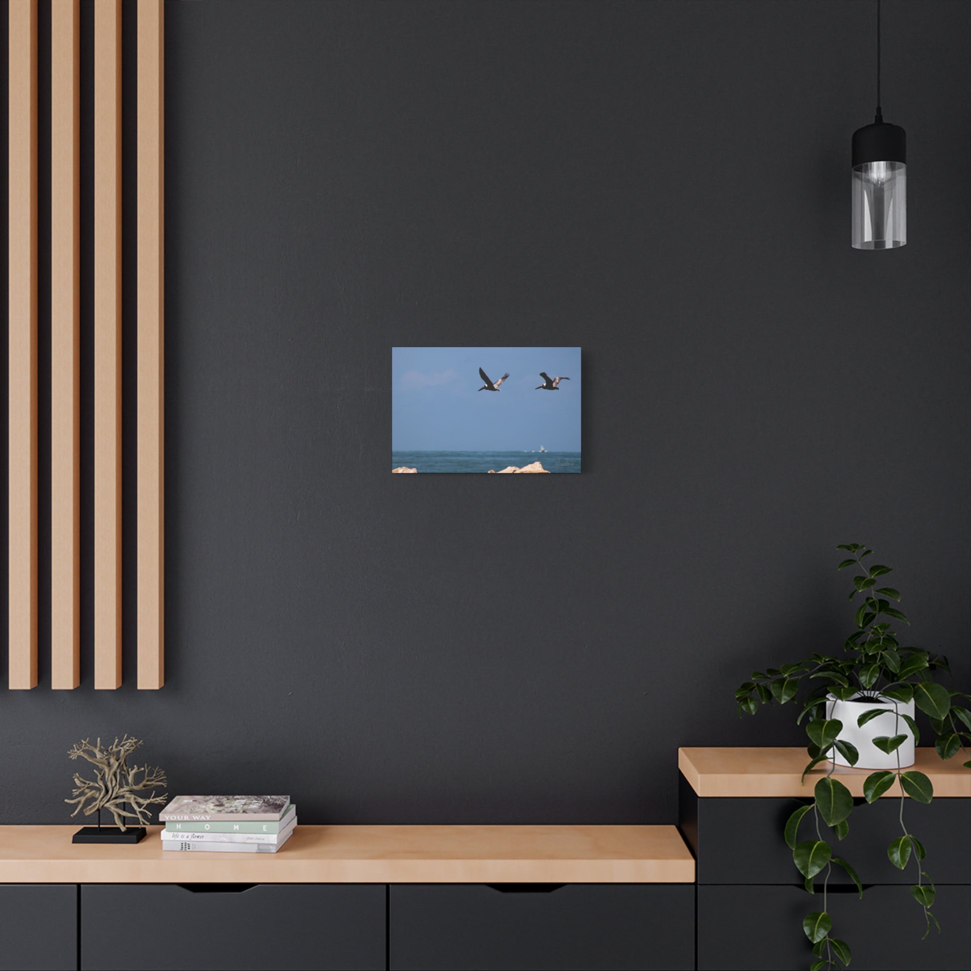Coastal bird wall art on display in a modern home setting with a sleek wooden shelf