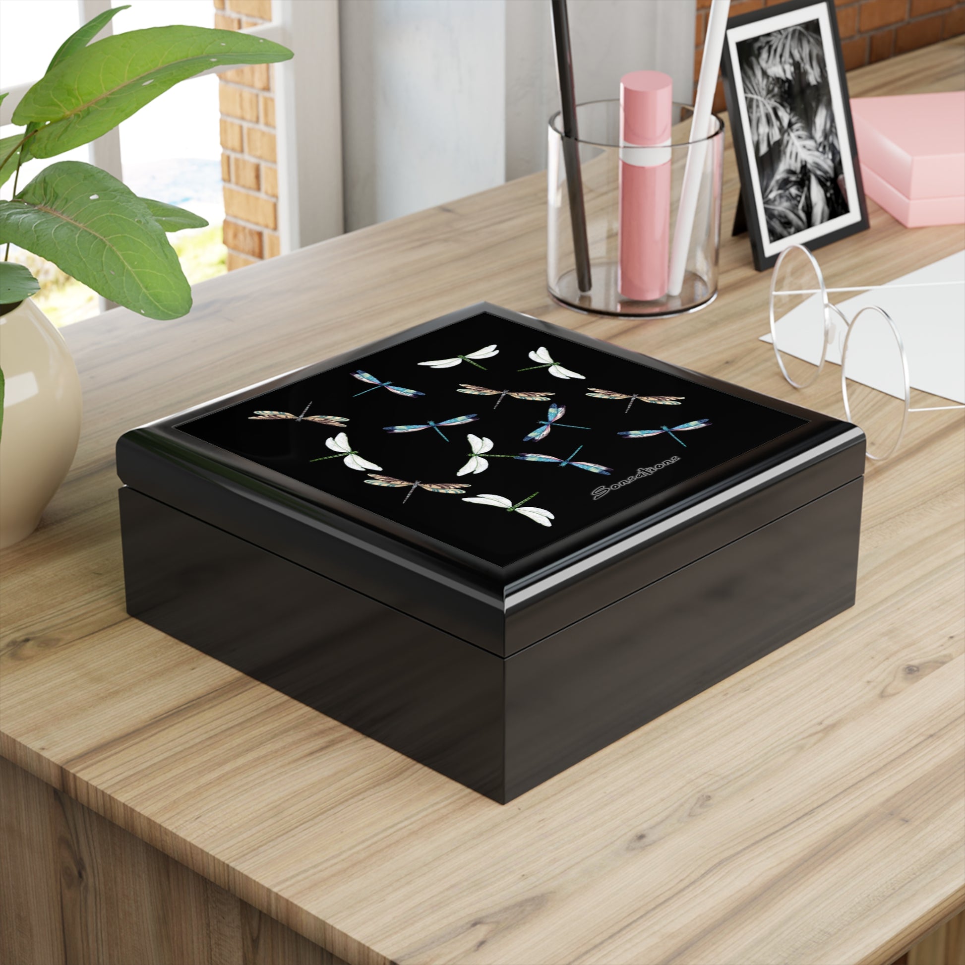 Elegant dragonfly jewelry box with intricate design, perfect for storing accessories on a desk