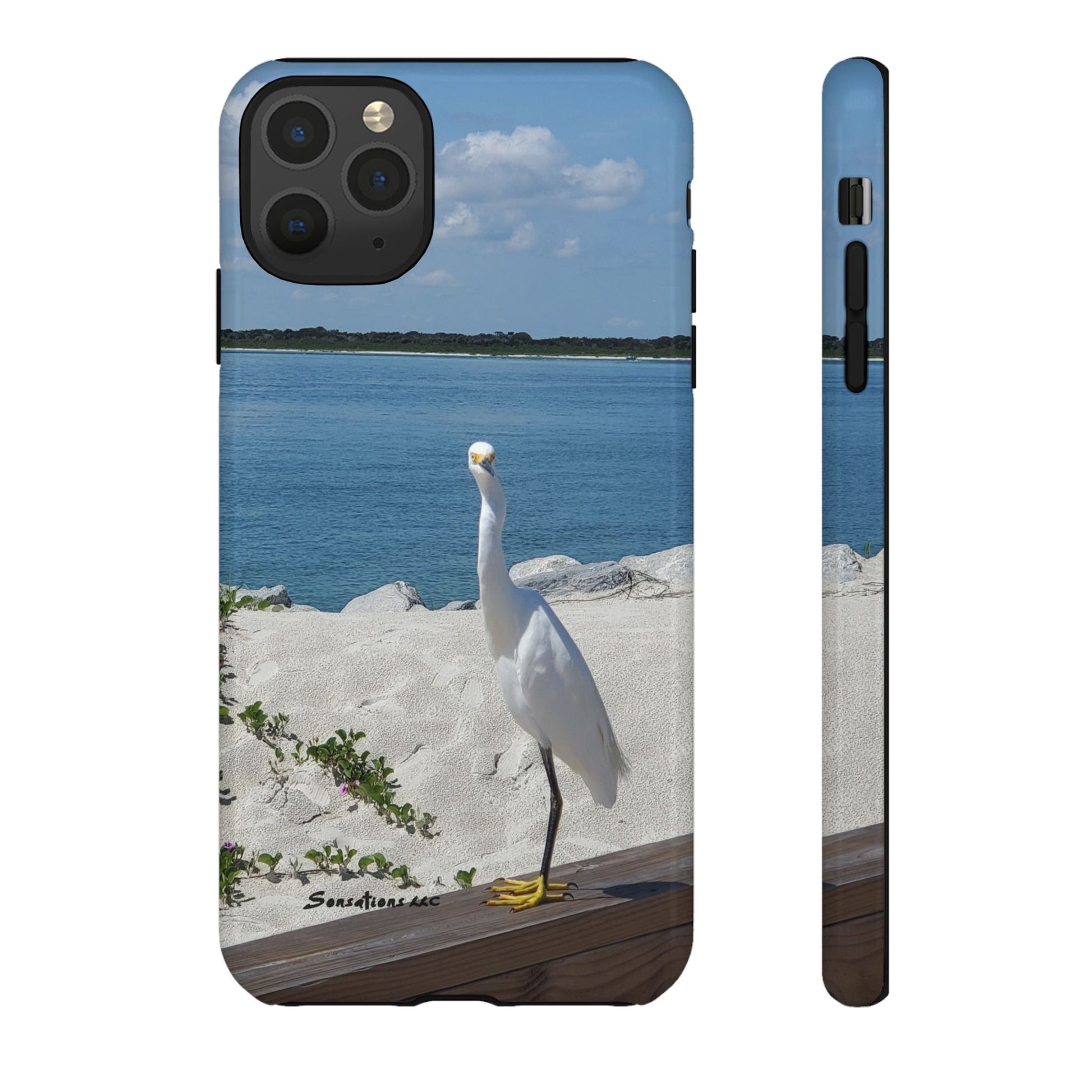 White bird phone case featuring a heron standing by the beach near the water