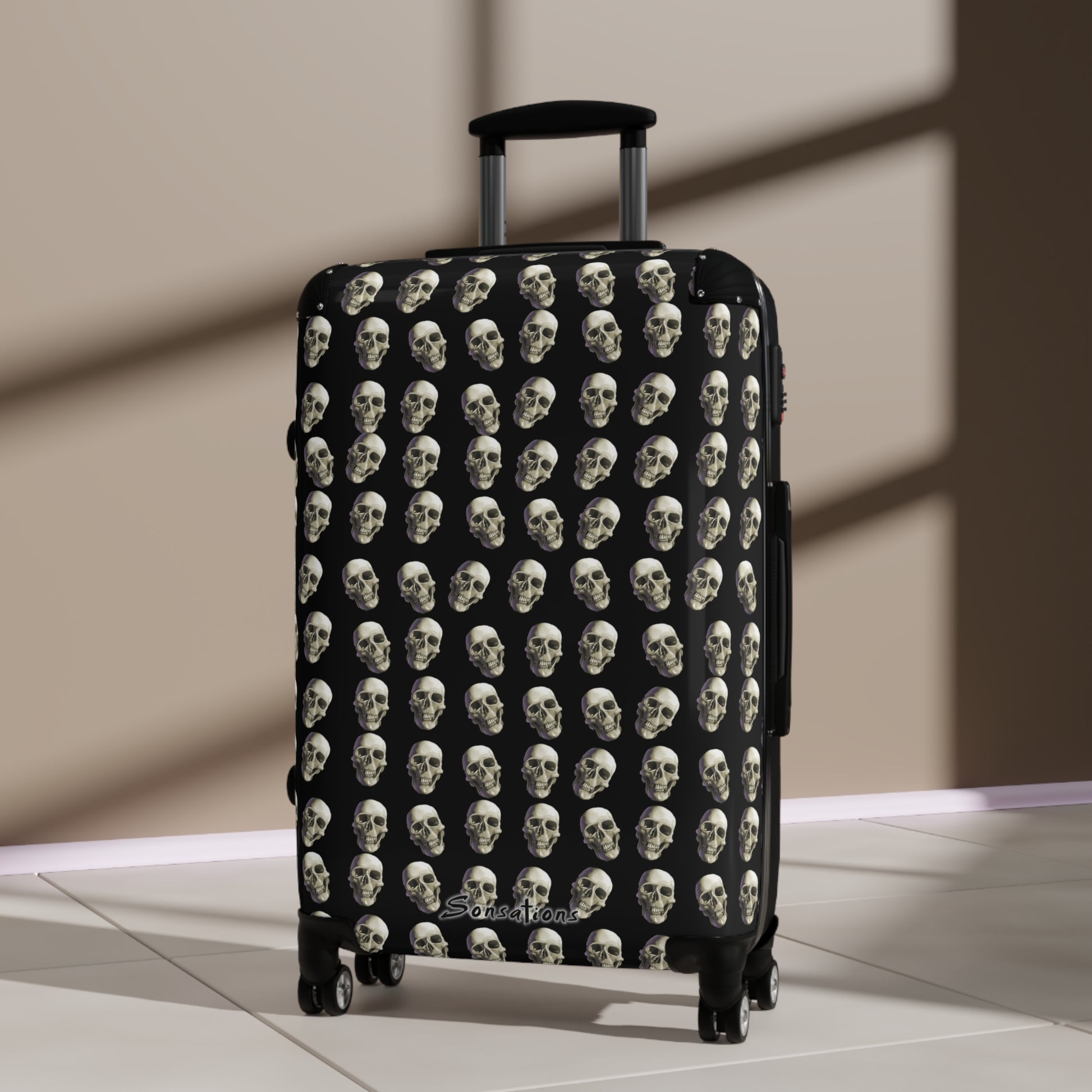 Skull print suitcase featuring a striking design of multiple skulls on a black background for stylish travel