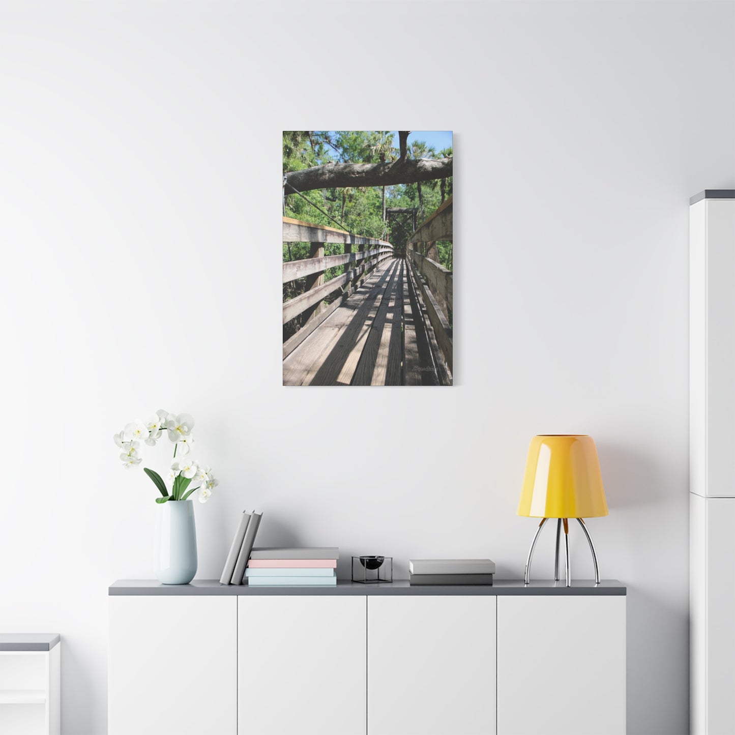 Tranquil bridge nature wall art depicting a serene wooden pathway surrounded by greenery