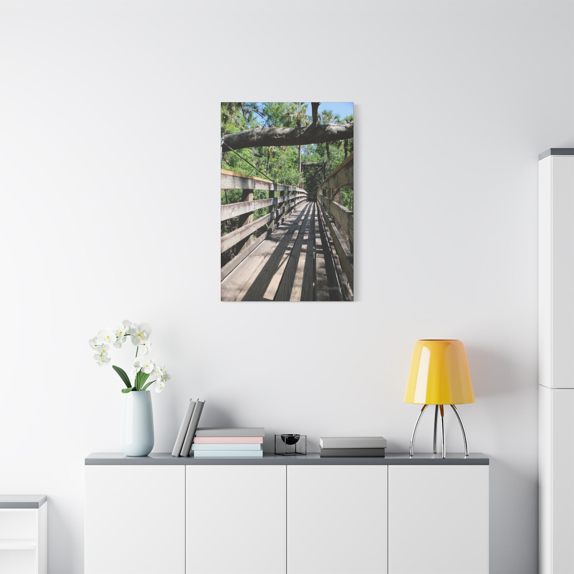 Tranquil bridge nature wall art depicting a serene wooden pathway surrounded by greenery
