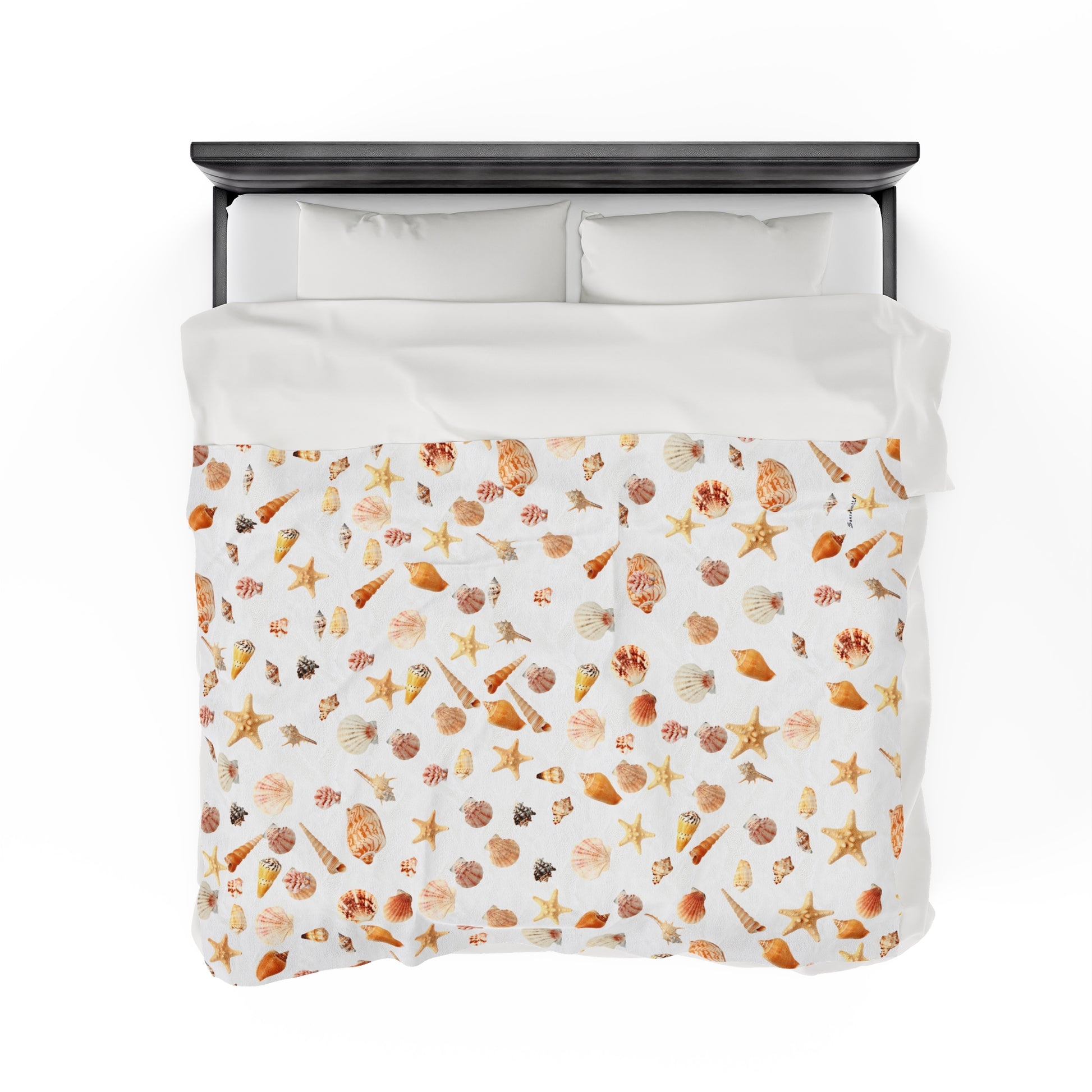Sea shell velveteen blanket featuring a colorful all-over print of seashells and starfish on a white background