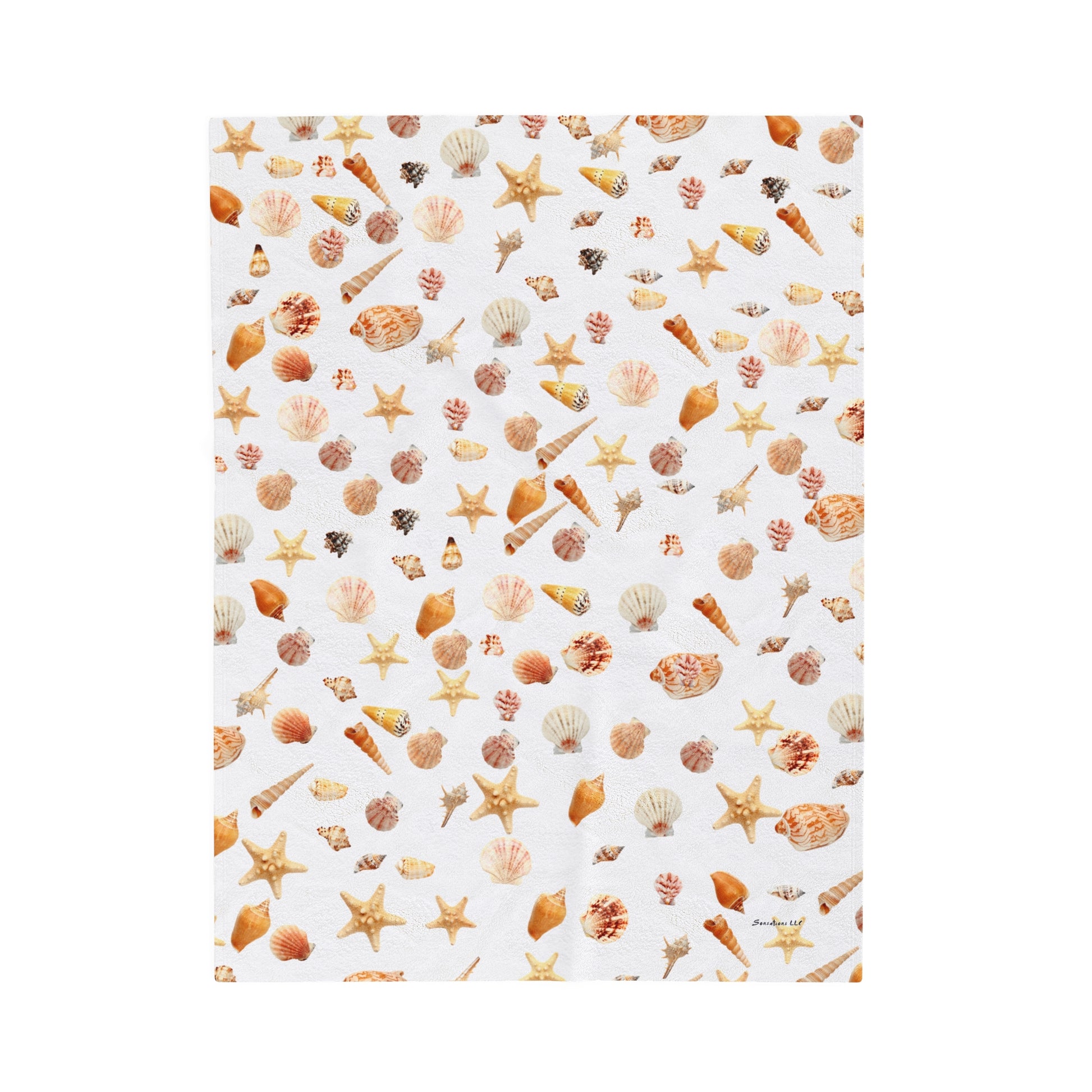 Sea shell velveteen blanket featuring a colorful pattern of seashells and starfish on a white background