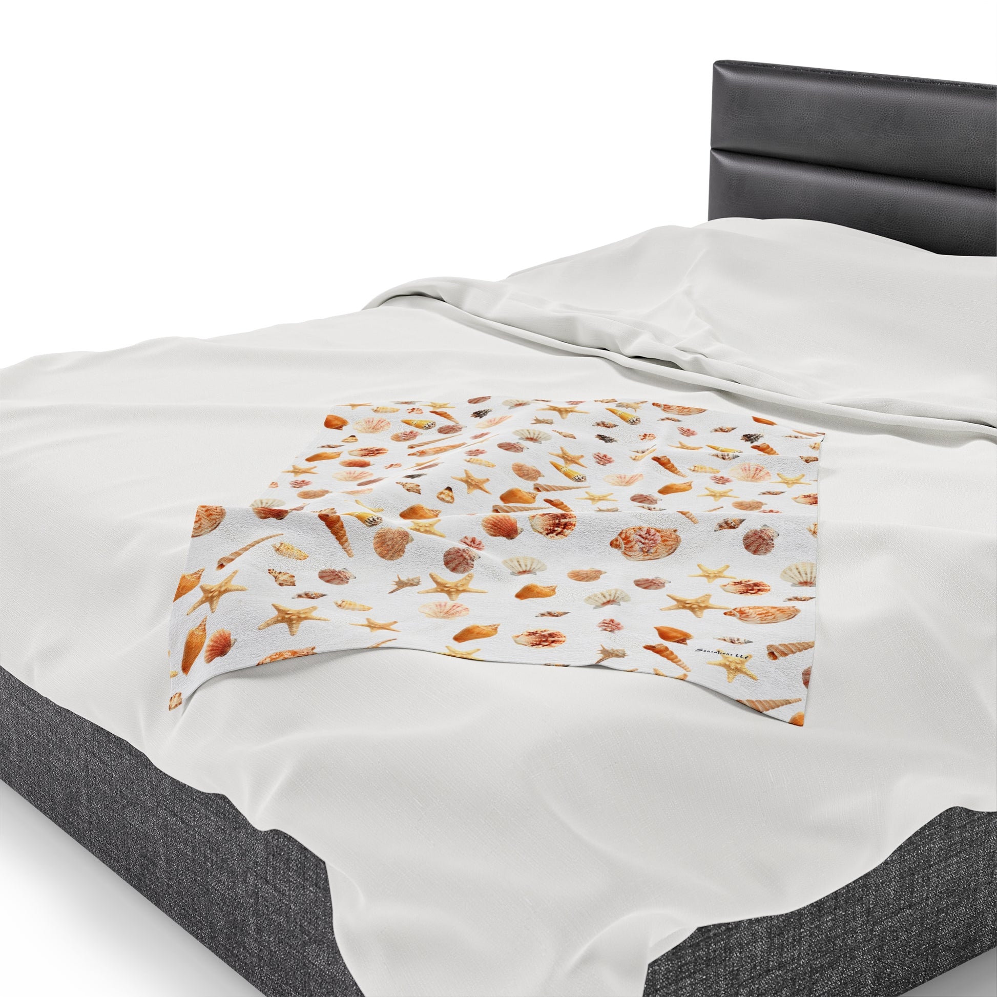 Sea shell velveteen blanket featuring a vibrant all over print on a soft fabric for cozy warmth